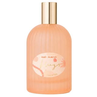 Roze geribbelde fles Kenkô Hugs Spray - Body, Home & Linen met gouden dop naast de geïllustreerde verpakking op een witte achtergrond.