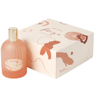 Roze geribbelde fles Kenkô Hugs Spray - Body, Home & Linen met gouden dop naast de geïllustreerde verpakking op een witte achtergrond.