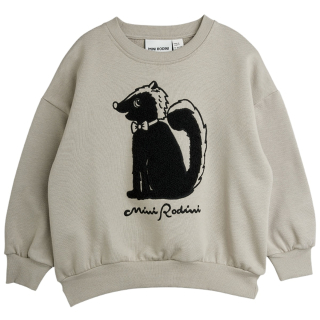 Mini Rodini Skunk Chenille Sweatshirt in beige met een grote zwarte stinkdier-applicatie van zachte chenille op de voorkant.